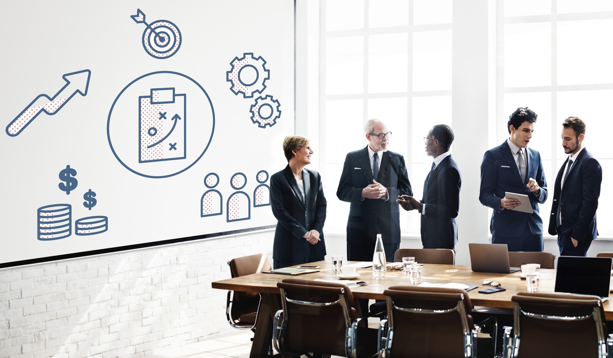Leadership team reviewing operating performance in a boardroom